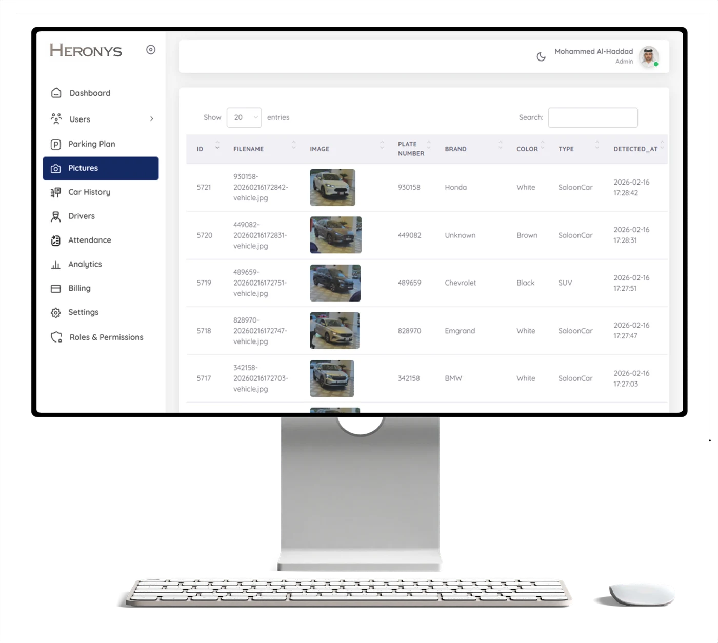 Heronys admin console on a desktop monitor: live vehicle records with plates, brands, and detection times